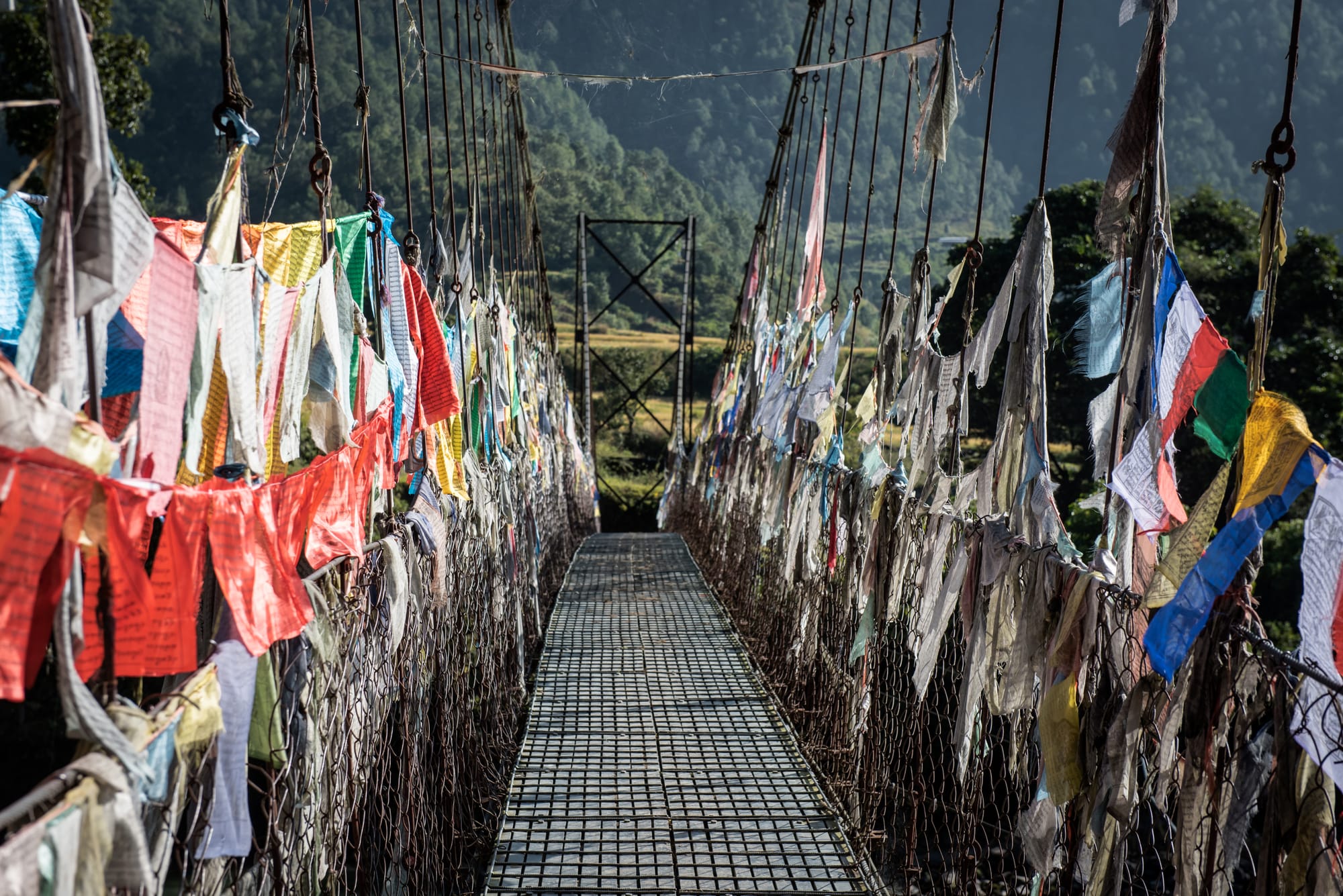 Punakha Suspension Bridge Bhutan prayer flags river